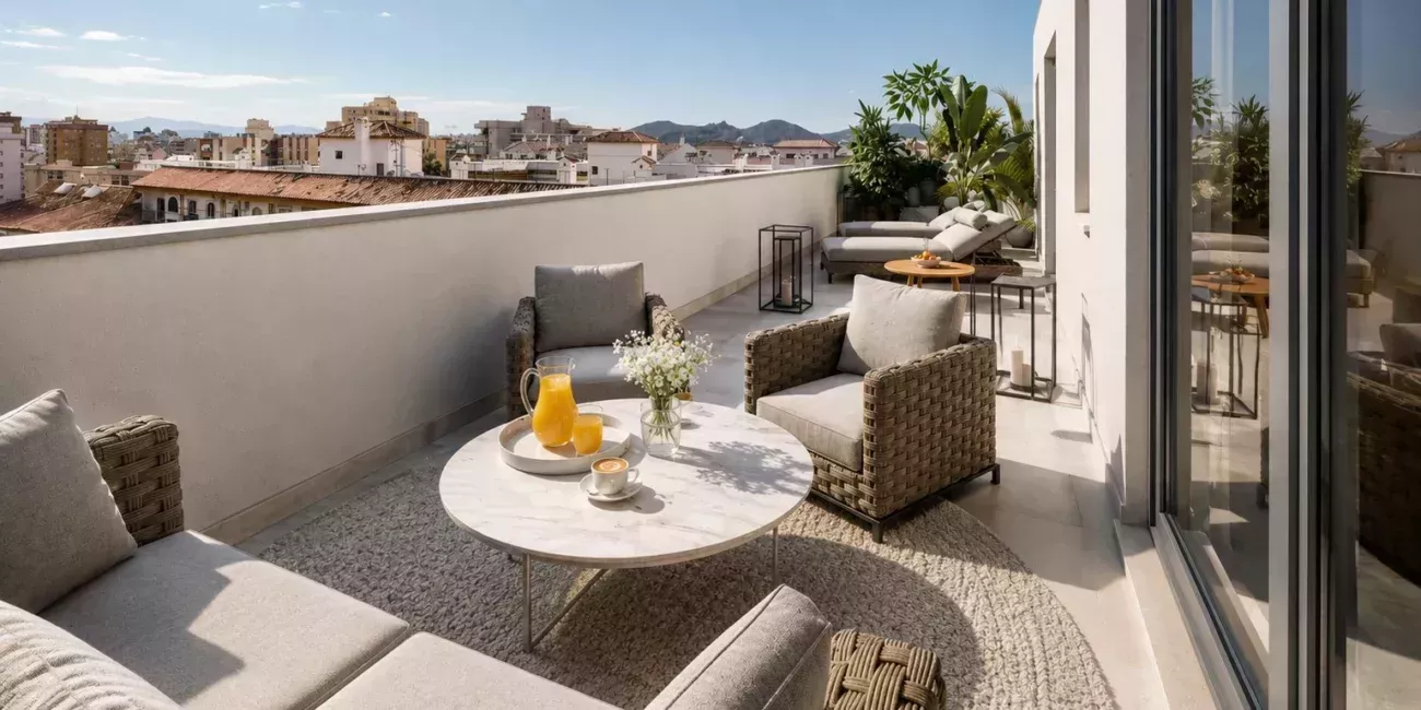 Corner terrace with lounge seating and dining area overlooking the Mediterranean