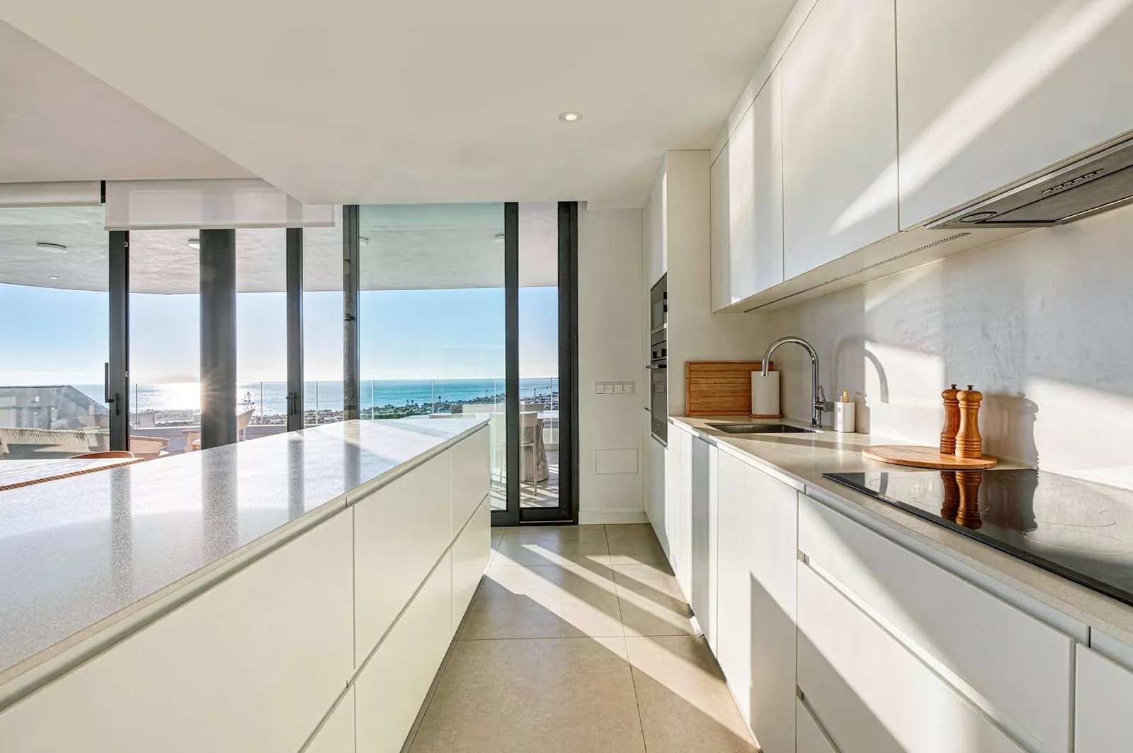 Long kitchen with a window onto the sea in the HW3 apartment