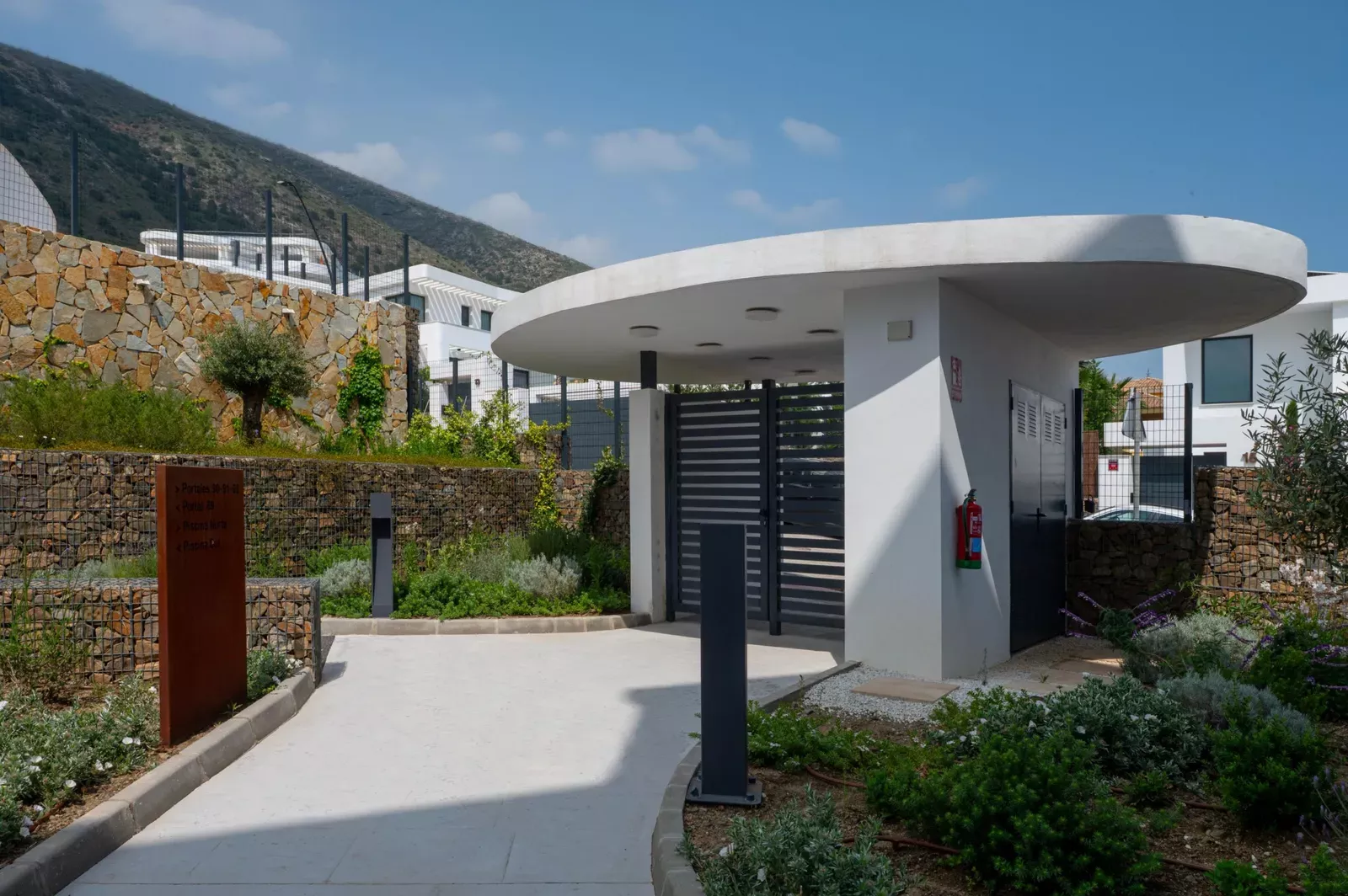 White pavilion and path among vegetation at the HW3 development