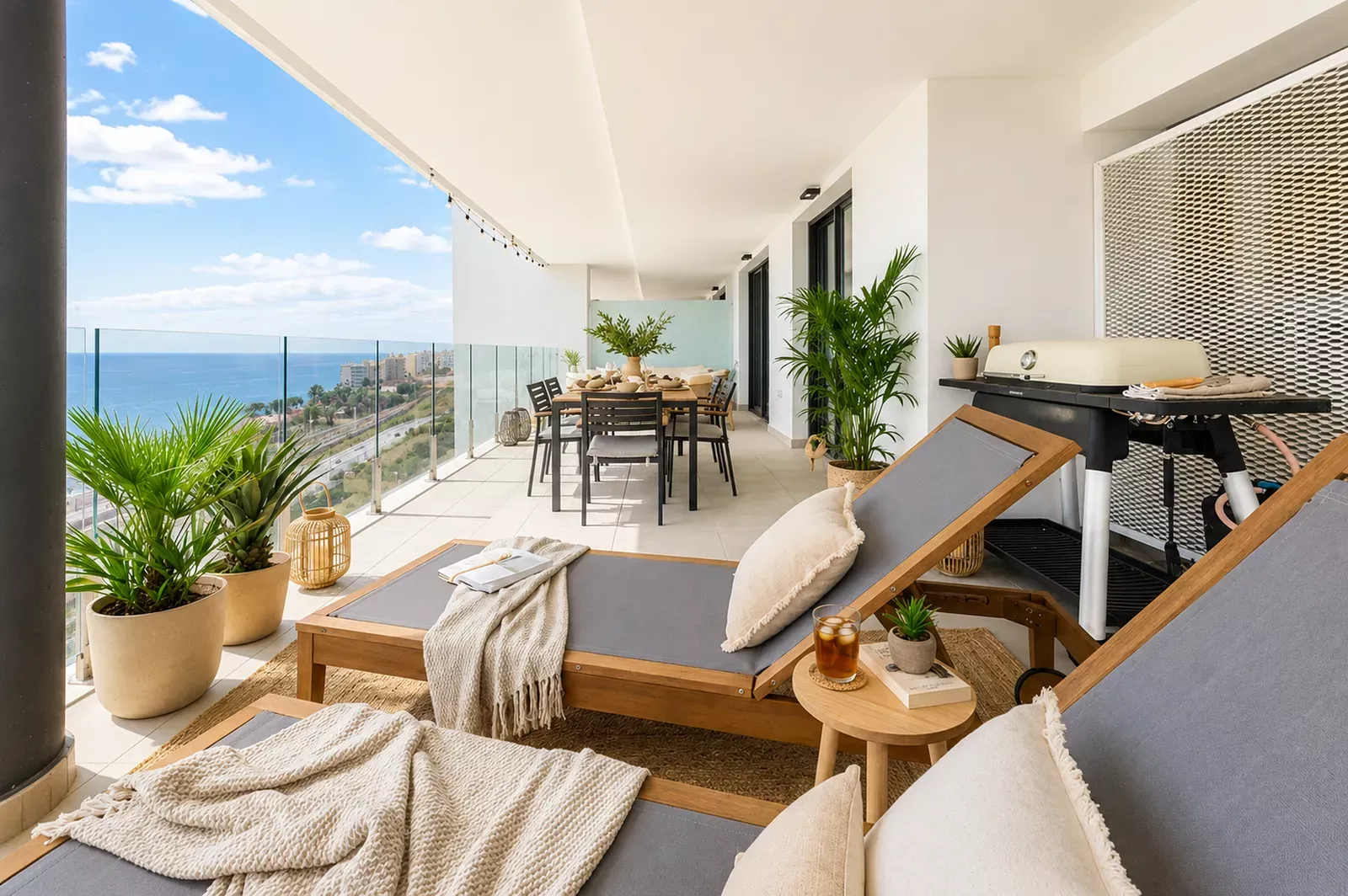 Open-plan living room with glazed terrace doors and sea views