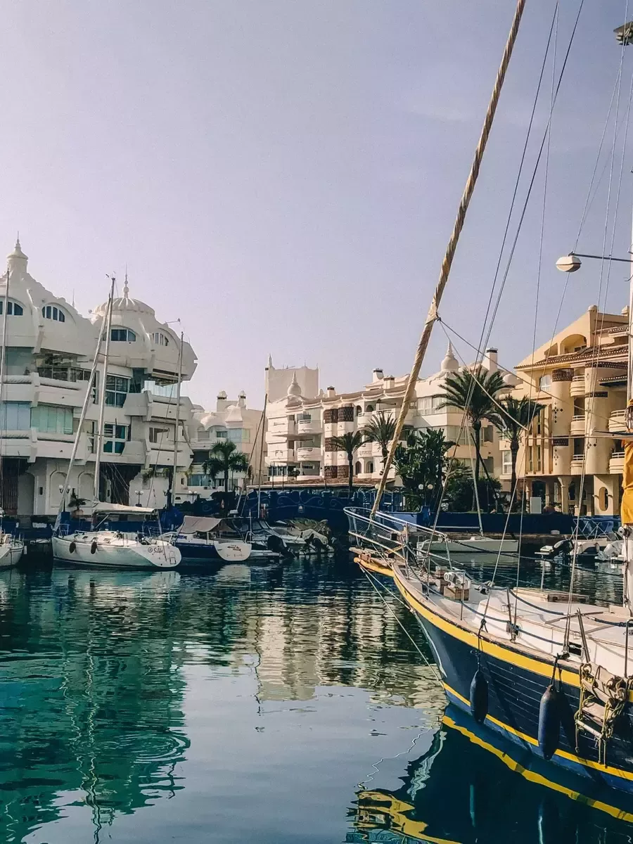 Vertical view of Benalmádena marina with sailboat masts and buildings