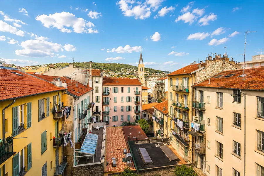 Colourful Belle Époque buildings along a street in Nice seen from above