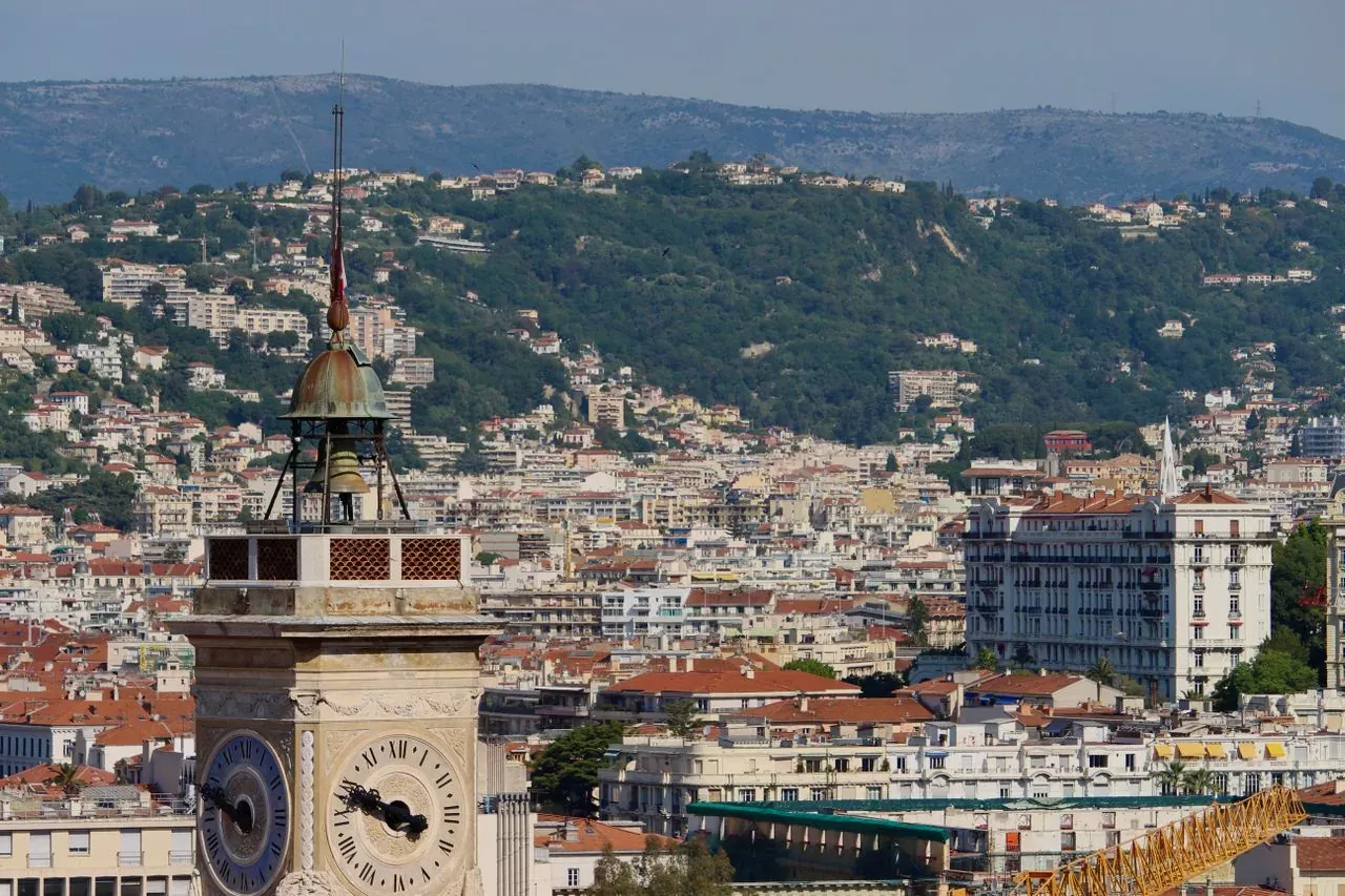 Old Nice rooftops and a bell tower seen from the hills