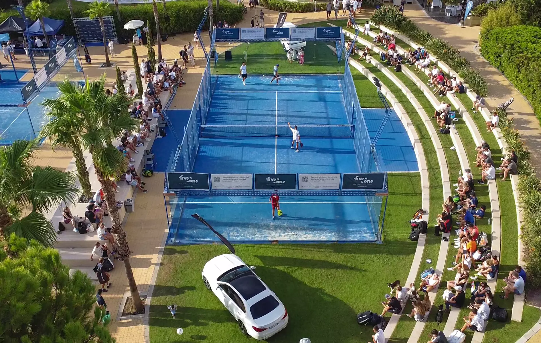 Aerial view of the five2one Padel Open 2026 court with spectators and stands